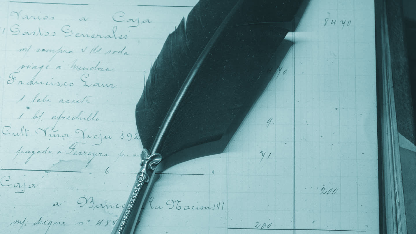 Ruled ledger paper covered in handwritten figures